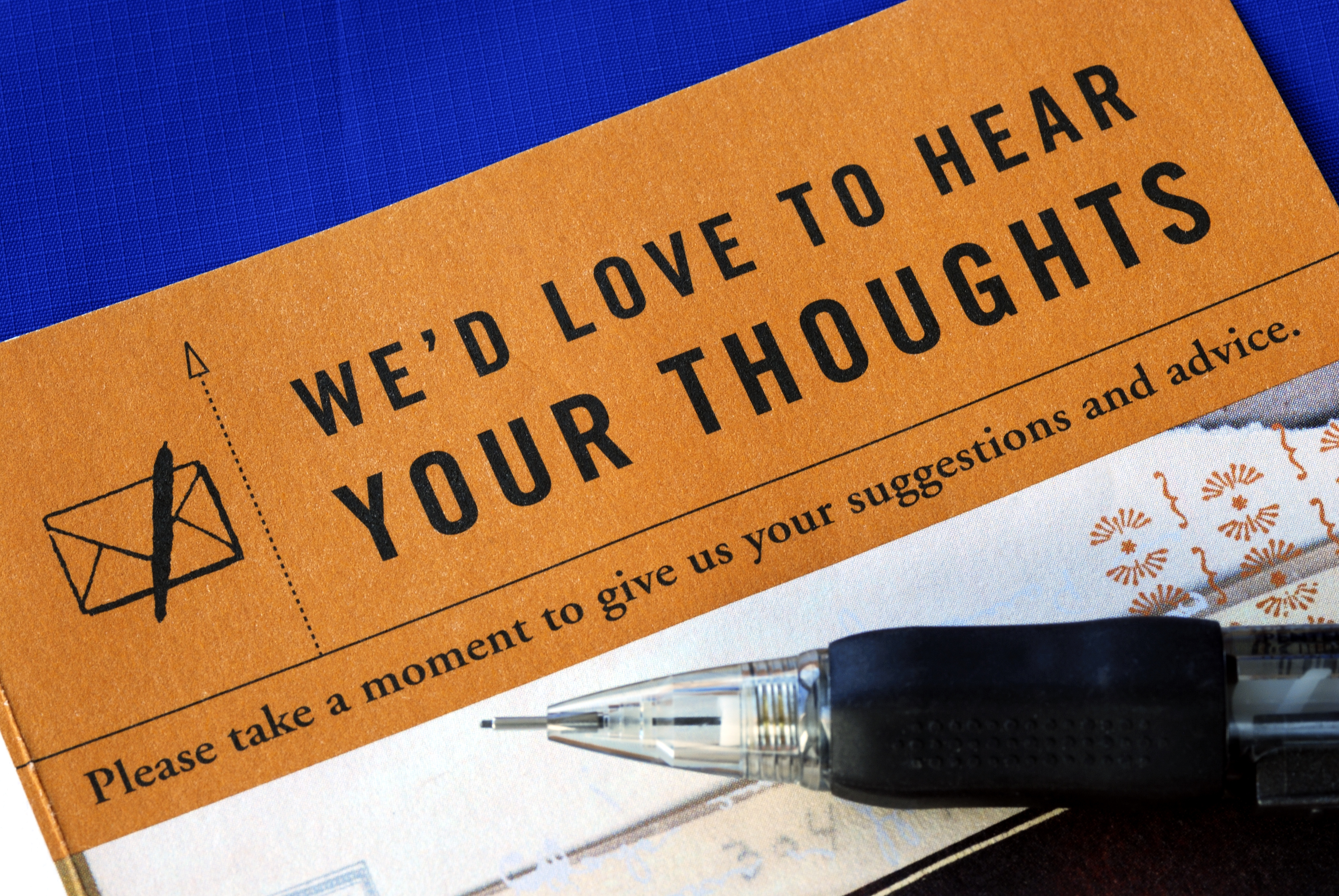 Customer fills in the feedback survey isolated on blue